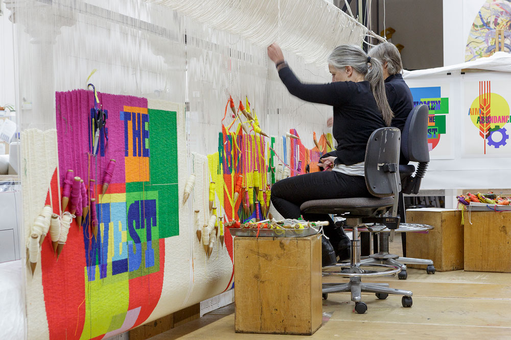 Pamela Joyce weaving on the 'The Declaration of the Rights of the Child', 2018, Emily Floyd, wool, cotton, 3 tapestries 2.0m (H) x 1.3m (W) each. Courtesy of the artist and Anna Schwartz Gallery. Photo: Jeremy Weihrauch.
