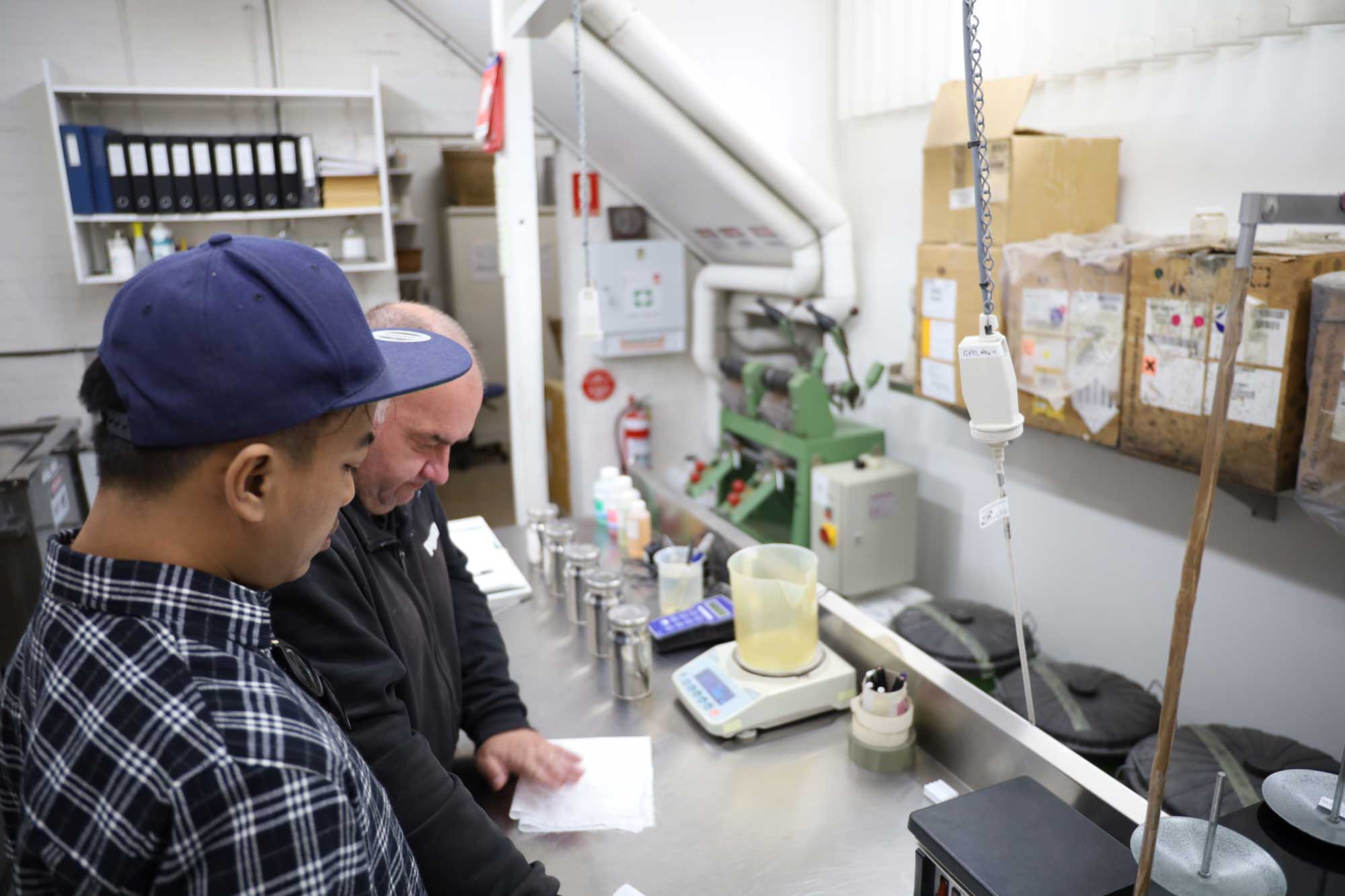 Dias Prabu working with ATW dyer Tony Stefanovski in the colour laboratory. Photo: Dewie Bukit. 