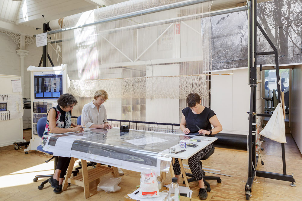 Sue Batten, Sophie Morris and Karlie Hawking preparing the cartoon for '22 Temenggong Road, Twilight.' 