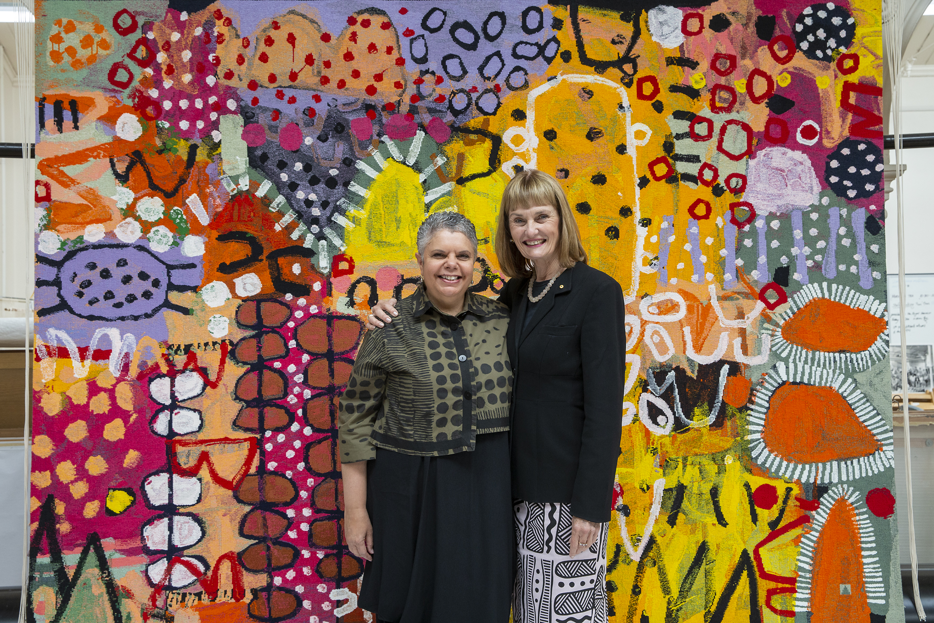 ATW Director Antonia Syme AM and Deborah Cheetham AO with ‘The Royal Harvest’, 2021, Naomi Hobson, currently on loan to the Australian Embassy to Indonesia, Jakarta. Photo: John Gollings AM. ATW Director Antonia Syme AM and Deborah Cheetham AOwith ‘The Royal Harvest’, 2021, Naomi Hobson, currently on loan to the Australian Embassy to Indonesia, Jakarta.Photo: John Gollings AM.