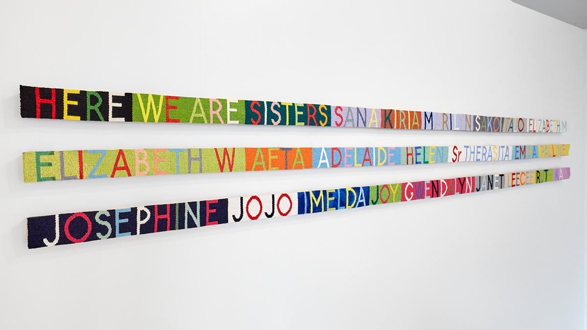 ‘Here we are sisters’ 2018, Kay Larence AM, wool, cotton warp on aluminium, 3 parts: 7.5 x 347cm (each). Image Jeremy Weihrauch. 