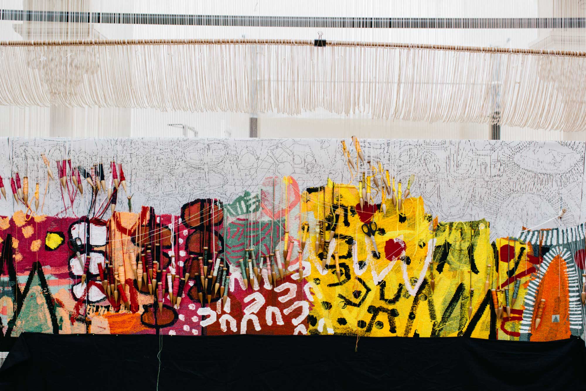 On the loom: 'The Royal Harvest' tapestry in progress, designed by Naomi Hobson and woven by Pamela Joyce, Sue Batten, Tim Gresham & Jennifer Sharpe. Photo: Marie-Luise Skibbe.