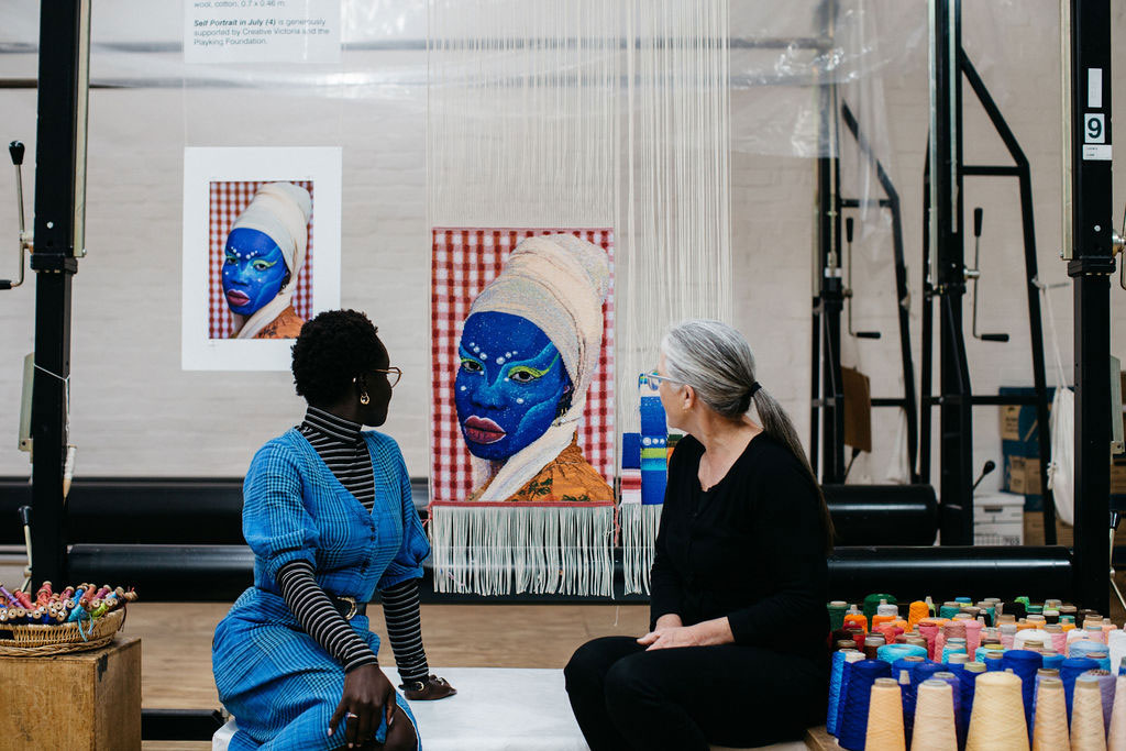 Atong Atem and Pamela Joyce in front of the 'Portrait in July (4)' tapestry, designed by Atong Atem in 2021. Photograph: Marie-Luise Skibbe.