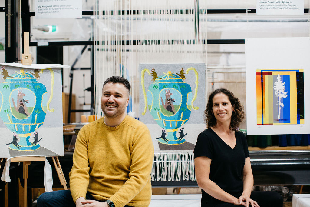 Troy Emery and Emma Sulzer in front of the 'big kangaroo urn' tapestry, designed by Troy Emery in 2021. Photograph: Marie-Luise Skibbe.