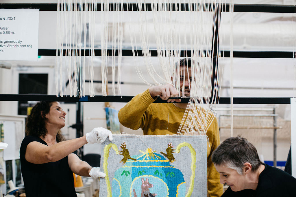 Emma Sulzer, Troy Emery and Saffron Gordon at the 'Weaving Futures' Cutting Off Ceremony at the ATW. Photograph: Marie-Luise Skibbe.