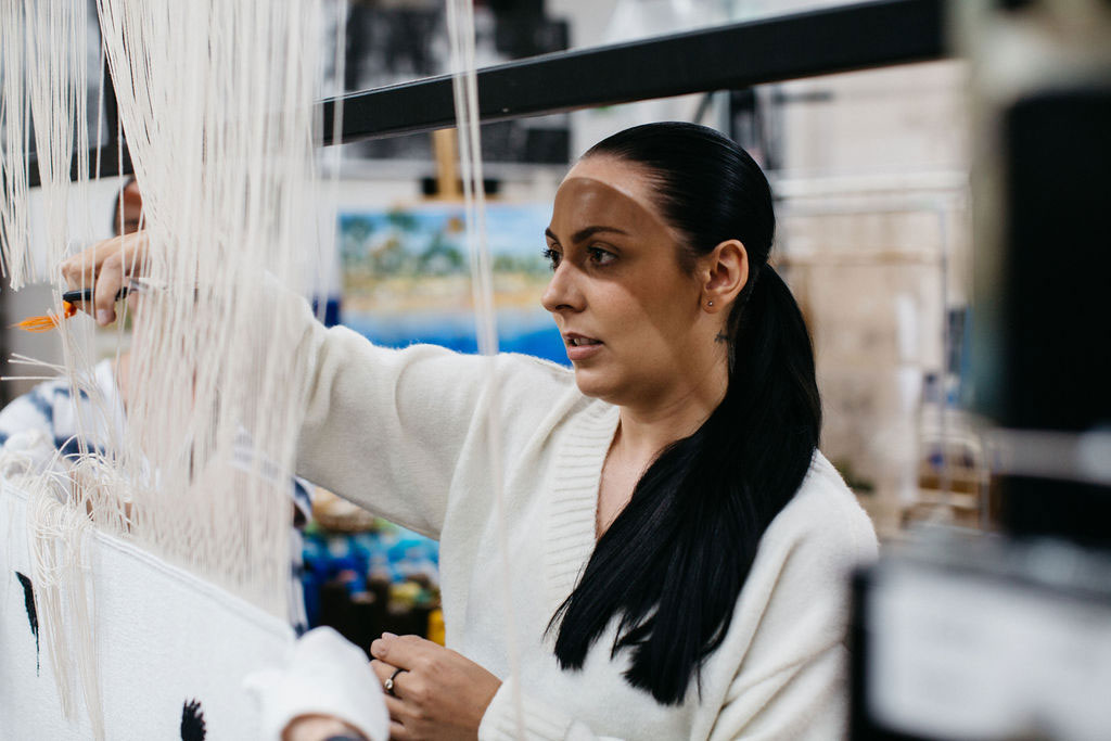 Hayley Millar Baker at the 'Weaving Futures' Cutting Off Ceremony at the ATW, 2021. Photograph courtesy of Marie-Luise Skibbe.