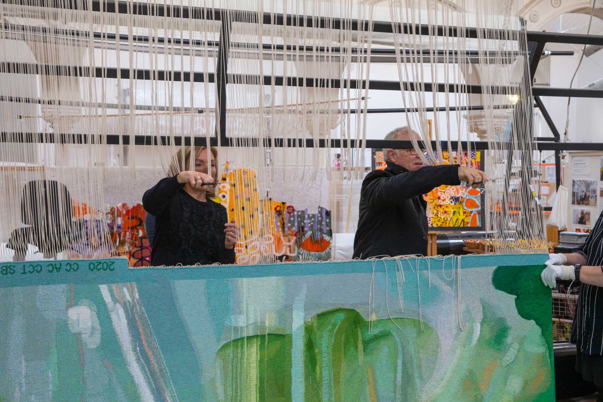 Cutting off Ceremony for 'Hear the Plant Song' tapestry, designed by Janet Laurence in 2020 and woven by Chris Cochius, Amy Cornall & Cheryl Thornton. Photo: John Gollings AM.