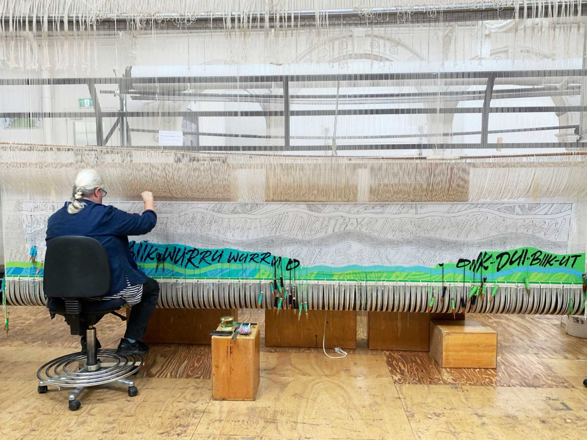 Tapestry in progress: Chris Cochius weaves the ‘Wurundjeri Biik, yalinguth, yalingbu, yirramboi’ tapestry designed by Mandy Nicholson. Photo ATW. 