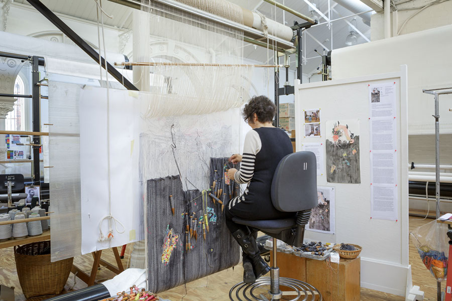 ATW weaver Sue Batten working on  ‘Everything has two witnesses, one on earth and one in the sky,’ 2014, designed by Sangeeta Sandrasegar, woven by Sue Batten, wool and cotton, 1.64 x 0.89m. Photograph: Jeremy Weihrauch.