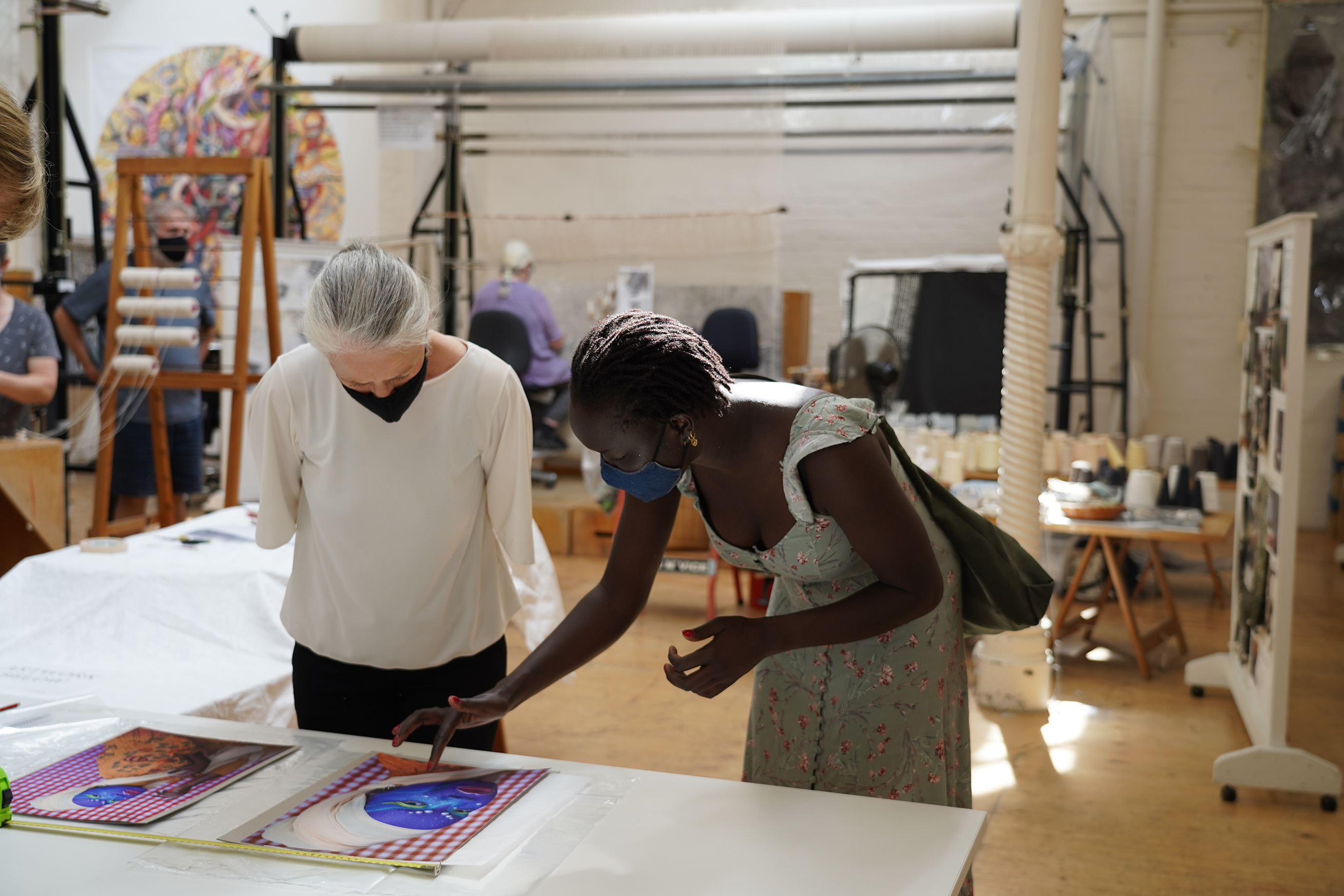 ATW weaver Pamela Joyce & artist Atong Atem discussing the 'Self Portrait in July (4)' tapestry design at the ATW, 2021. Photograph: ATW.