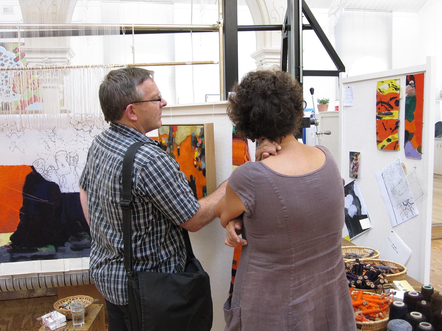 Brent Harris with ATW weaver Sue Batten discussing the progress of 'Rome' designed by Brent Harris in 2012. Photograph: ATW.